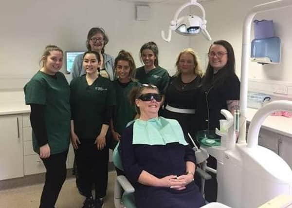 Claudia pictured with apprentices at Apco Dental.
