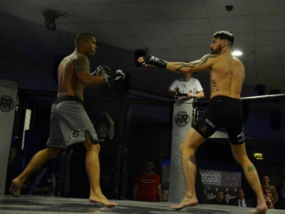 Chris Bungard (right) made light work of his Brazilian opponent (Submitted pic)