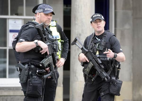 Armed police on the streets following a terror alert. Photo by Neil Hanna Photography