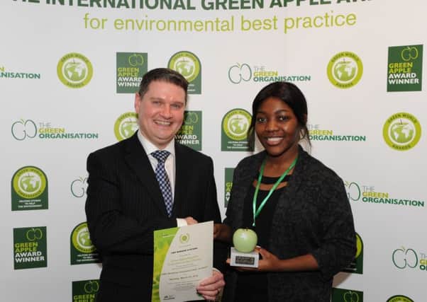 CMS Window Systems CEO David Ritchie and environmental officer Grace Waku with the Scottish Green Apple Award