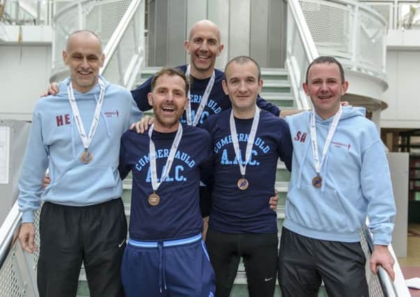 The Cumbernauld squad celebrate their bronze medal success at the National Road Relay Championships.( pic by Bobby Gavin)