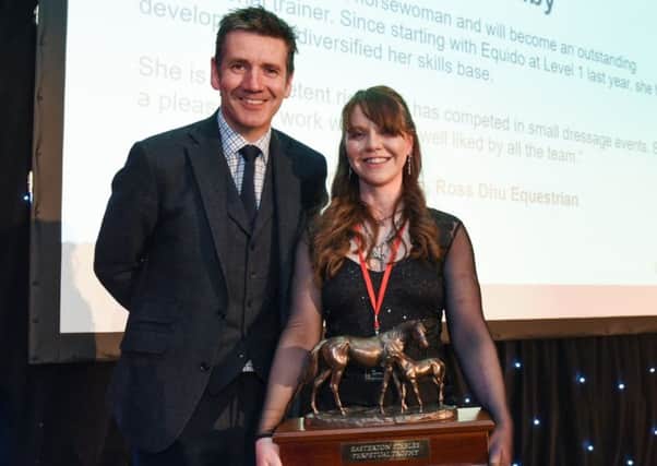 Laura pictured receiving her award from Dougie Vipond.