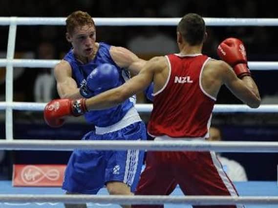 Scott Forrest is pictured fighting at the 2014 Commonwealth Games in Glasgow