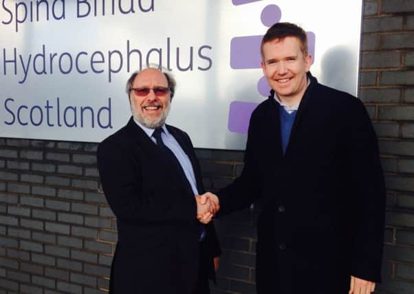 Spina Bifida Hydrocephalus Scotland chief executive Andrew Wynd welcomes Cumbernauld, Kilsyth and Kirkintilloch East MP Stuart McDonald to the centre