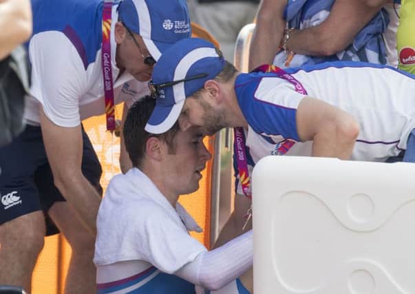 A distressed John Archibald is treated after his terrifying crash (pic by Jeff Holmes)