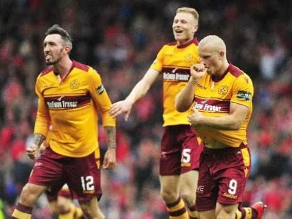 Motherwell ace Curtis Main (right), whose partner Stevie is expecting their second child, celebrates the opening goal against Aberdeen with Ryan Bowman and Andy Rose! (Pic by Alan Murray)