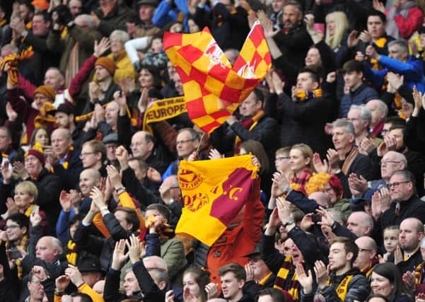 Motherwell supporters celebrate their teams 3-0 victory over Aberdeen at Hampden of Saturday. Pic: Alan Murray