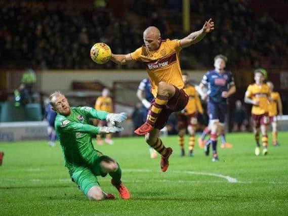 Motherwell's Curtis Main and Ross County goalkeeper Scott Fox crossed swords on Saturday