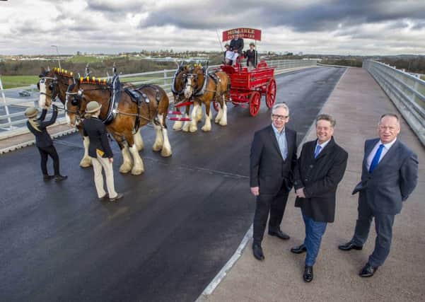 Mossed International Railfreight Park (MIRP) officially launches and PD Stirling celebrates with a team of Clydesdale horses crossing their new access bridge. Pic shows L/R Andrew Sritling, Keith Brown MSP (Cabinet Secretary for Economy, Jobs and Fair Work), and David Stirling. Pic Peter Devlin