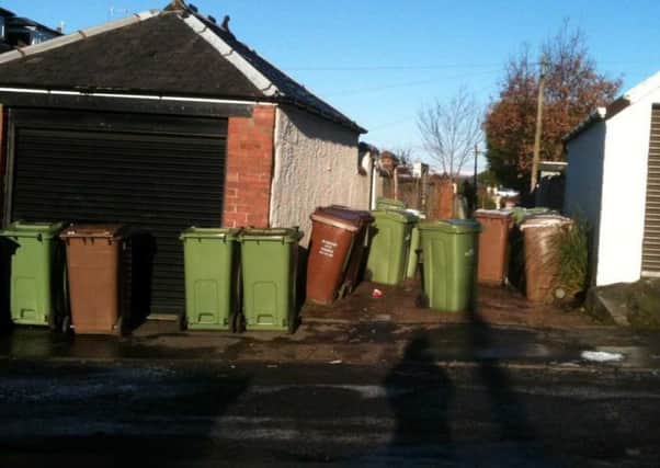 Netherlee residents are angry over being forced to leave bins on the street.