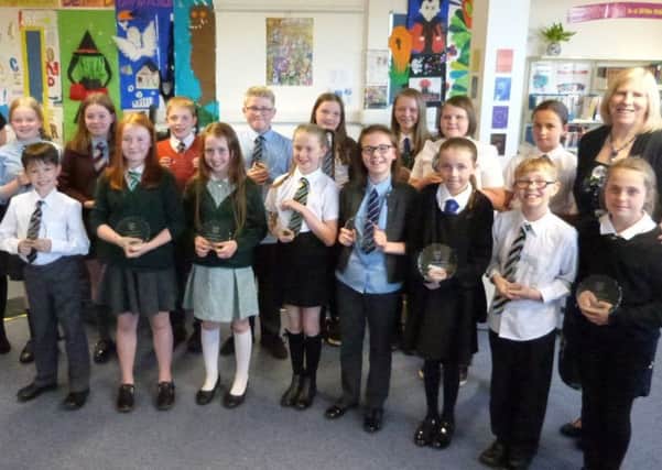 The participants of this years showcase are pictured with their trophies.