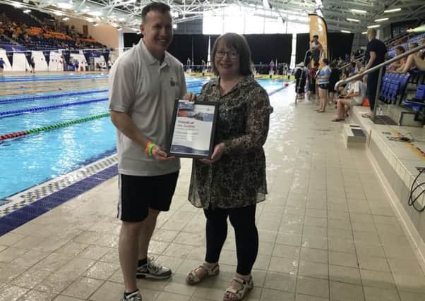Clare Adamson MSP receives her award from Bryan Finlay at the RLSS UK National Speed Championships