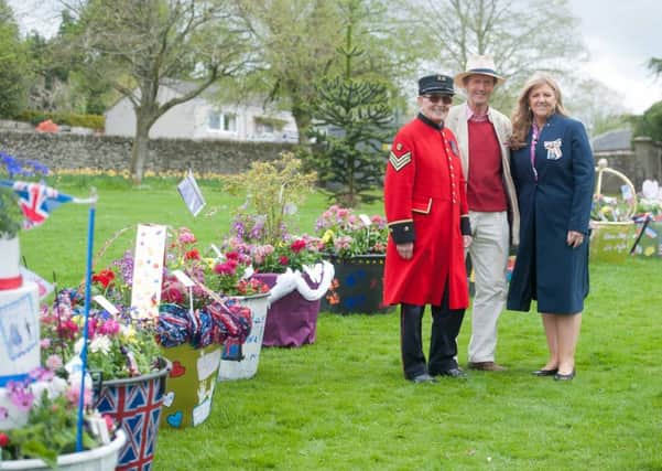 Royal date in the Royal Burgh...Lanark's own Chelsea Pensioner Walter Swan, Lanark Community Development Trust's Dr Jamie Hill and Lord Lieutenant of Lanarkshire, Lady Susan Haughey, officially opened the first Lanark Spring Flowerfest on Friday, May 11, 2018. (Pic: Jamie Forbes)