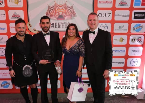 Arjun and his fiancee Talisha collect the Best Indian Restaurant award for The Indian on Skirving Street.
