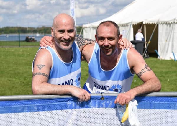 Mark Young (left) and James McAvoy taking part in the MND Scotland Fun Run at Strathclyde Park