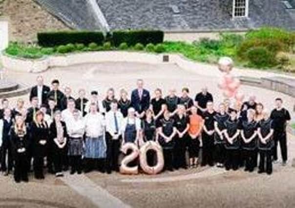 Hotel staff celebrate their new four star status.