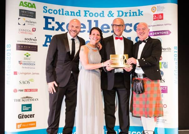 The Border Biscuits team with their award for Brand Success of the Year. They were also named Business of the Year.