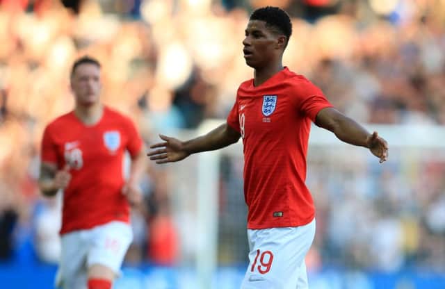 England's Marcus Rashford (right) celebrates scoring his side's first goal during a friendly against Costa Rica