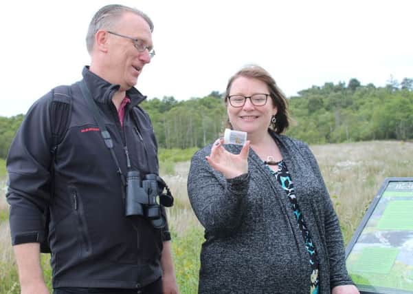 Motherwell and Wishaw MSP Clare Adamson learns about the small pearl-bordered fritillary from Butterfly Conservation volunteer Tam Stewart