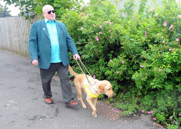 Guide dog owner Pat Duffy, with his dog Yoko, is backing the new fundraising group