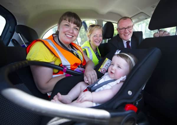 Councillor Michael McPake is pictured at one of the car seat safety events with, from left, Caroline Hay from Good Egg Safety and Frances Adams, the councils Safe & Sustainable Travel Officer.