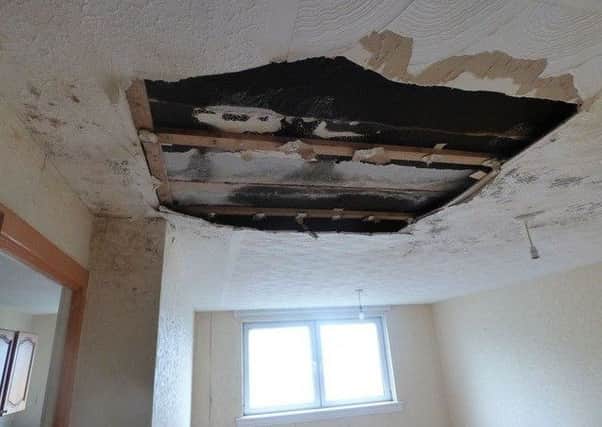 An image of the damage to the flat's ceiling published on the Auction Scotland listing