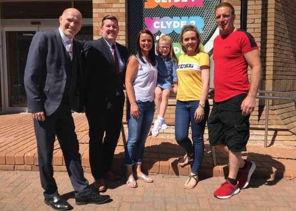 Michelle Campbell and daughter Elliot flanked by Together Energys David Gutherie and Graham Mathie and Radio Clyde presenters Cassie and George Bowie