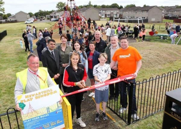 Chloe Rodger and Jamie Maughan cut the ribbon to officially open Newarthill Play Kingdom