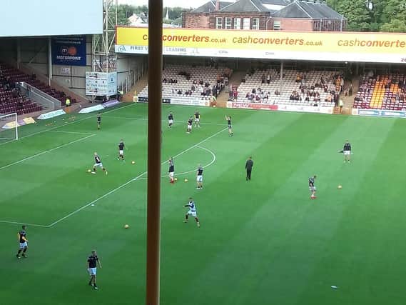Motherwell players warming up for tonight's Betfred Cup encounter against Edinburgh City