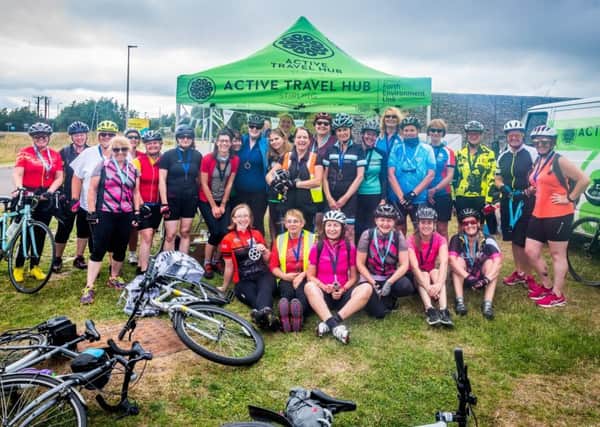 The Belles on Bikes from Cumbernauld and Falkirk receive their well deserved medals at the end of their 40-mile cycle through the Forth Valley. Pic: Andy Catlin