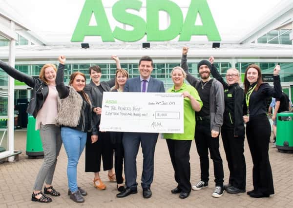 Jamie Hepburn MSP helps the Asda Foundation hand over a cheque for Â£18,000 to The Princes Trust Scotland. Pic: www.iangeorgesonphotography.co.uk