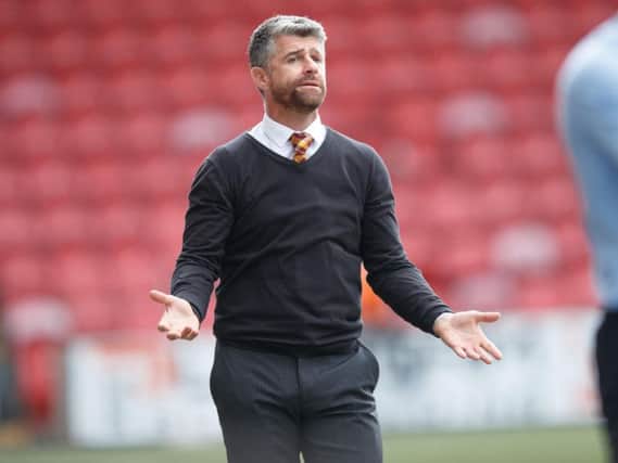 Stephen Robinson on the touchline at Broadwood