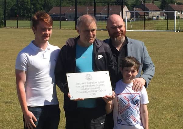 John Allan (centre) at opening of Crawforddyke Primary pitch named after him