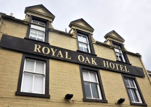 In happier days, The Royal Oak Hotel, now badly deteriorated,