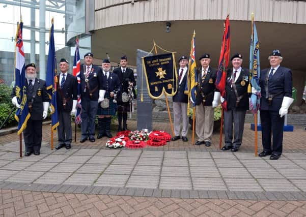 Raising the colours at last year's VJ Day service or remembrance