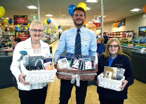 Following the reopening celebrations a product hamper was presented to Irene Gibbons (left) from ONC.