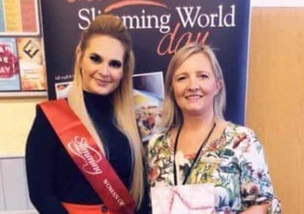 Natalie has been crowned the Carluke Slimmer of the Year. Pictured receiving her award.