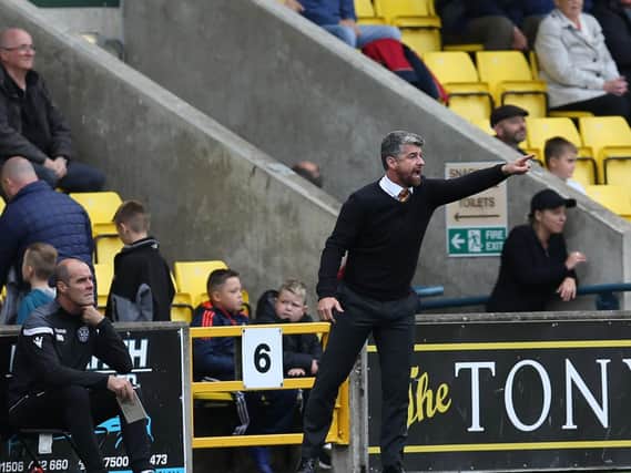 Well gaffer Stephen Robinson encourages his side at Livingston (Pic by Ian McFadyen)