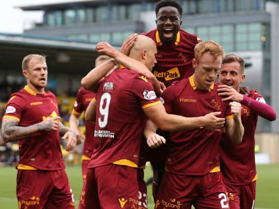 Elliott Frear (1st right) celebrates with goalscorer Danny Johnson and other team-mates after the winner at Livingston last Saturday (Pic by Ian McFadyen)