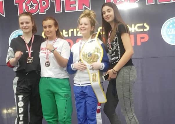 Cumbernauld's Lucy Buchanan (second right) won gold at the Workld Tae Kwondo Championships in Birmingham