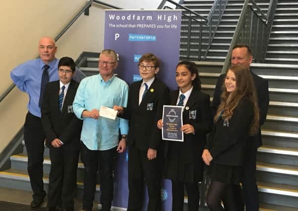 From left: Richard Phelan, social justice manager; pupils representing the S2 year group who took part in the event; RussellMacmillan, founder of East Renfrewshire Good Causes (ERGC); Mr Hillis, Depute Head Teacher.