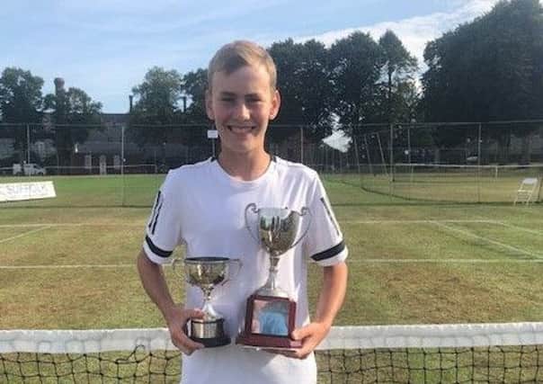 Andrew Wilson after winning the tennis singles and doubles titles at Framlingham