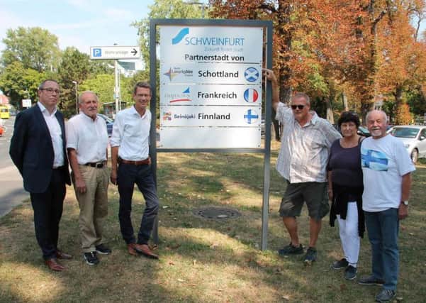 The new signs in Schweinfurt promoting town twinning get the seal of approval from (left to right) Ralf Brettin, head of Building and Development; Councillor Kurt Vogel of the Friends of Chateaudun Twinning; Oberburgermeister Sebastian Remele; Uwe Walther, chairman of the Friends of North Lanarkshire Twinning; Ute Schumann, Friends of Chateaudun; and Gerd Muller, The German-Finnish Society in Schweinfurt