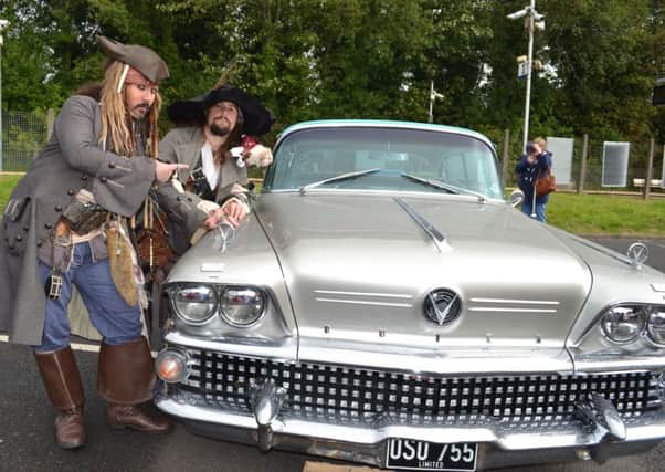 Cap'n Jack Sparrow and Captain Hector Barbossa with Buddy Holly's Buick