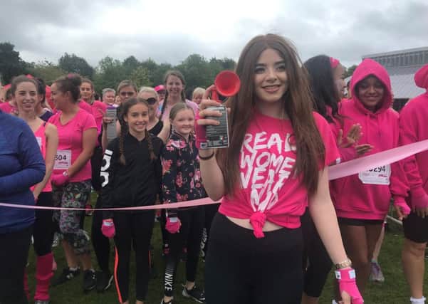 Natalie sounds the horn to start Race for Life Pretty Muddy Glasgow