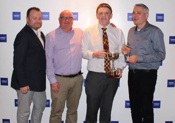 Ross Kerr (centre right) receives his Apprentice of the Year award from (l-r) Paul Douglas, vice-president of Volvo Rigid Haulers and managing director of Terex Trucks, HR director Paul Tierney, and operations director Paul Hudson