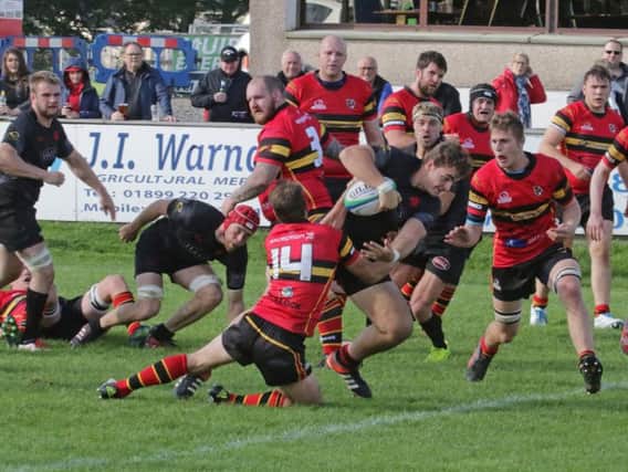 Guy Kelly about to touch down for Biggars bonus point try against Stewarts Melville (Pic by Nigel Pacey)