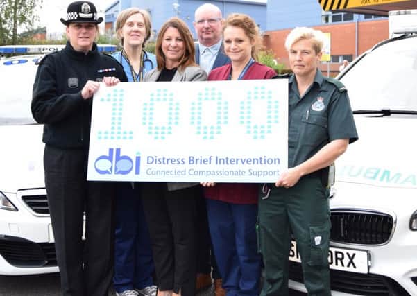 (l-r) Julie Robertson; Lorna Bruce, NHS Lanarkshire senior nurse mental health and learning disabilities; Lise Axford; Tracey Lochrie, Scottish Ambulance Service paramedic. Joined by Anne Tweed; and Sean O'Rawe; both from Lanarkshire Association for Mental Health