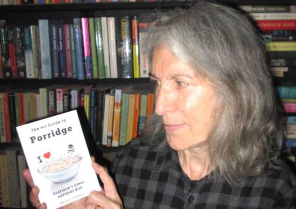 Deedee Cuddihy with a copy of 'The Wee Guide to Porridge'.