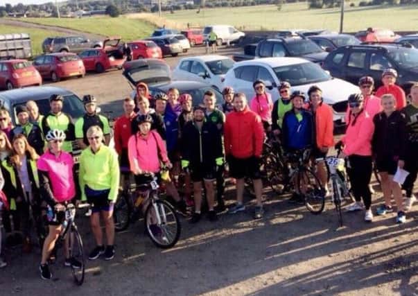 Members past and present of Biggar YFC gather for their marathon bike ride
